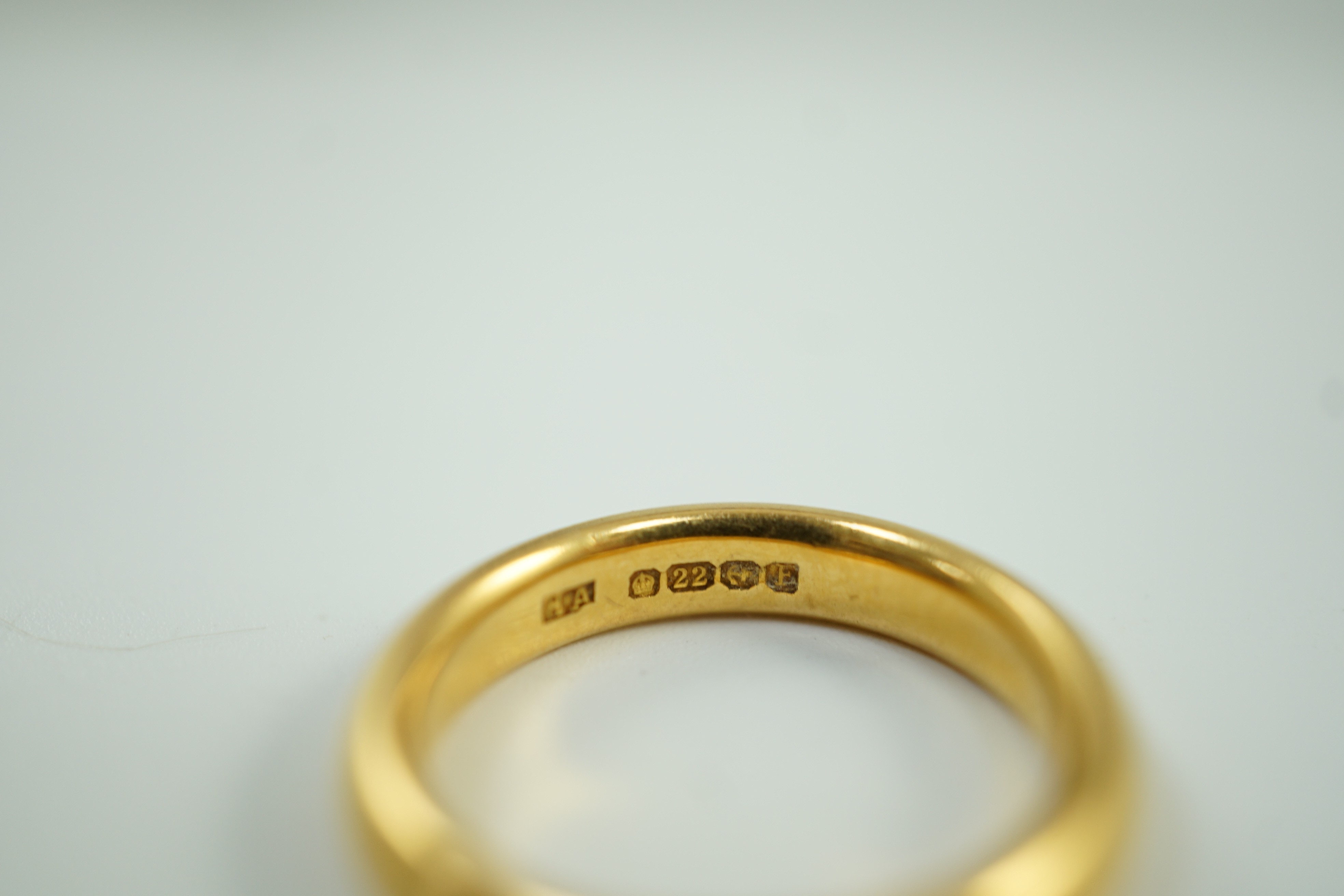 A 1930's 22ct gold wedding band, size M, 7.8 grams.